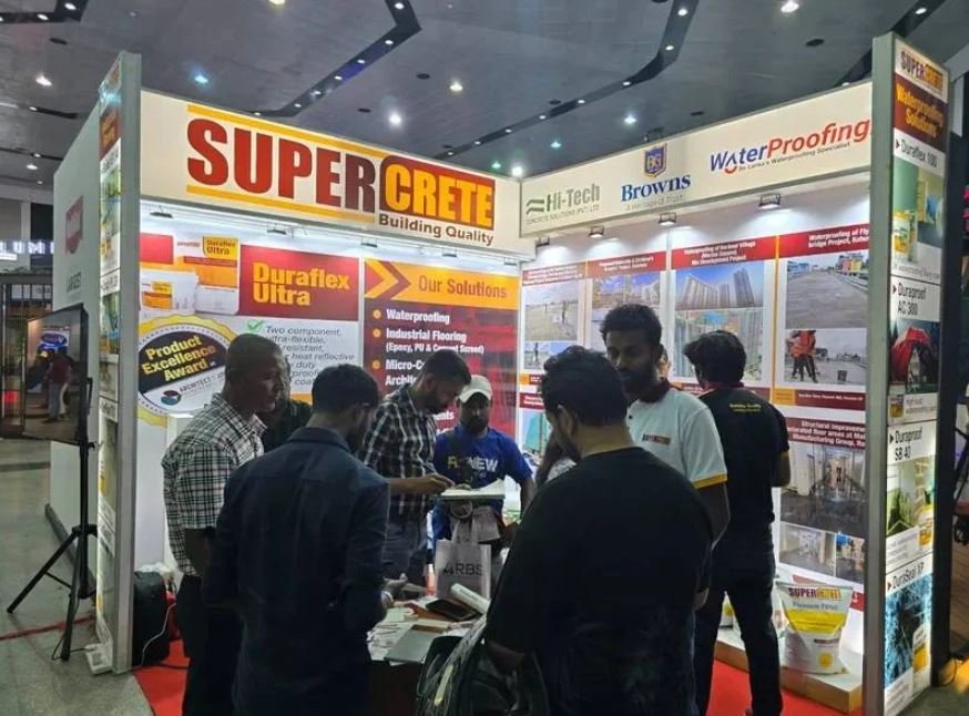 Supercrete team engaging visitors at an industry exhibition stand